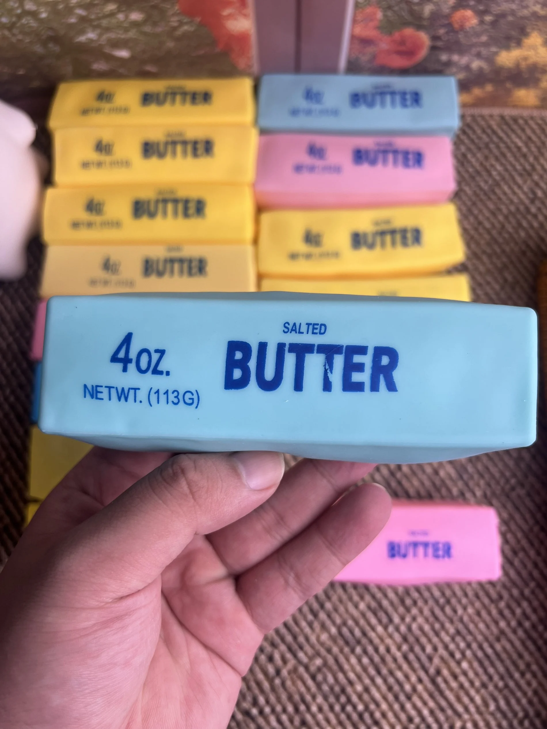 Blue butter squishy held in hand
