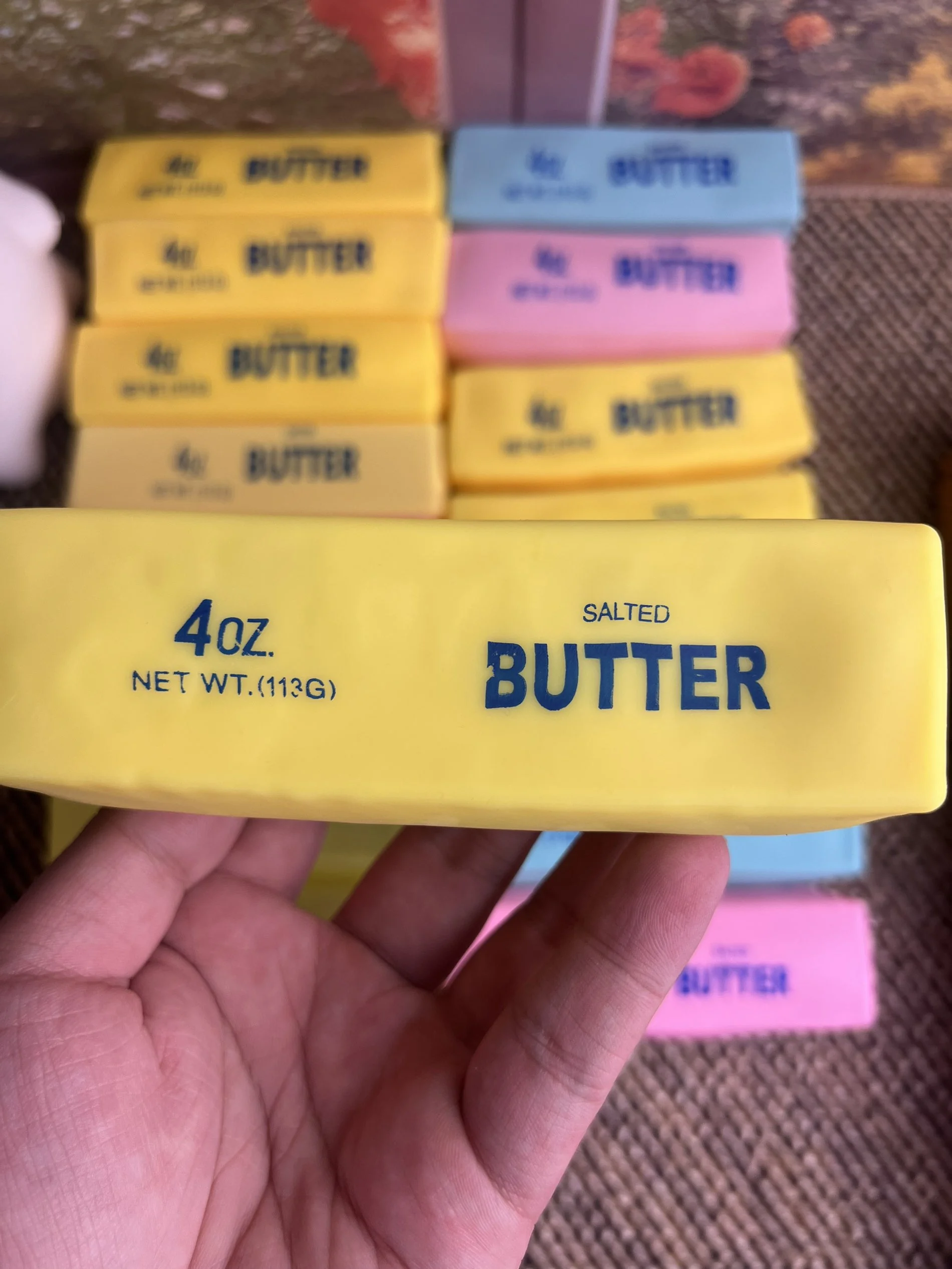 Yellow butter squishy held in hand