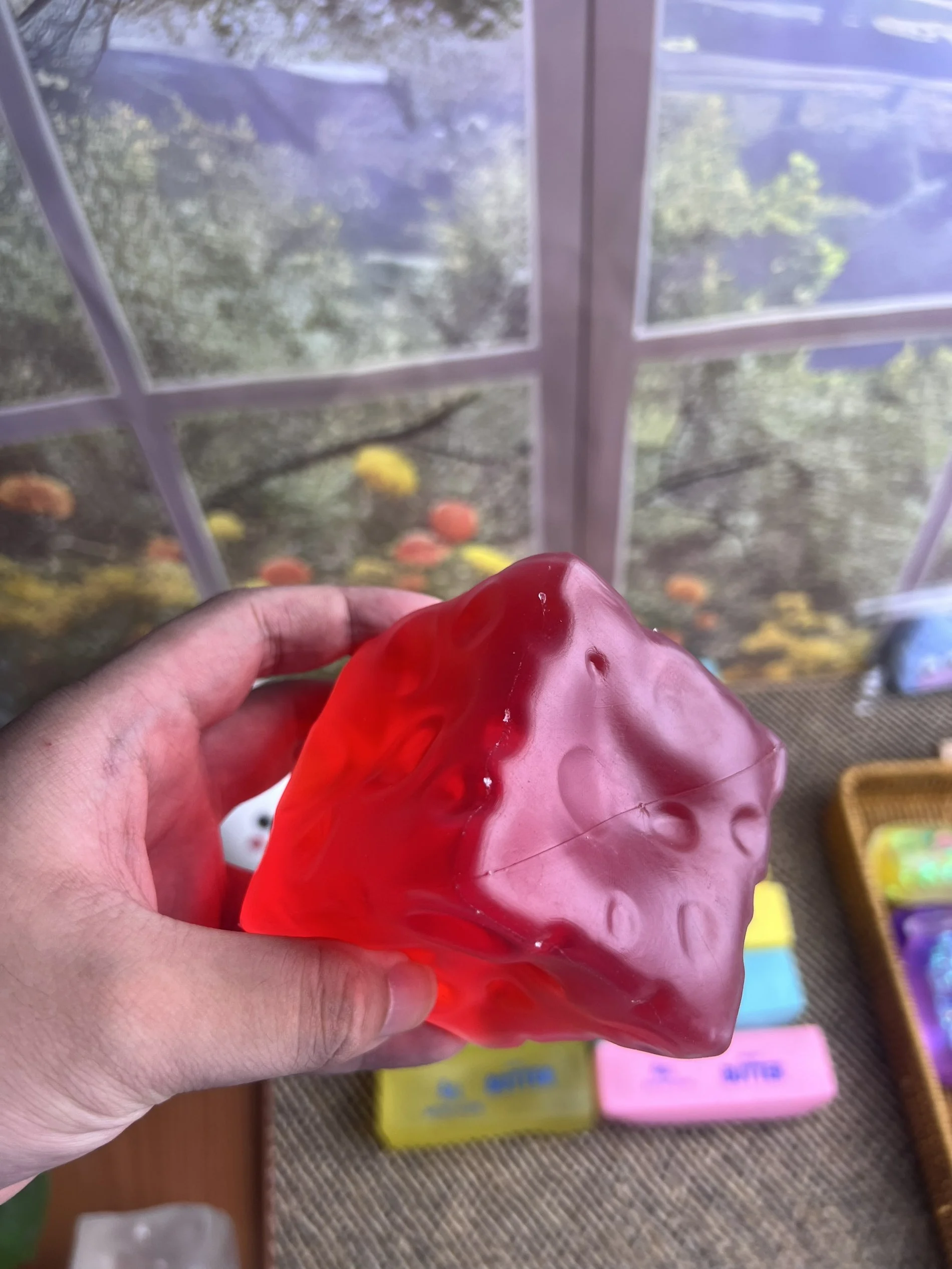 Pink cheese squishy squeezed by hand